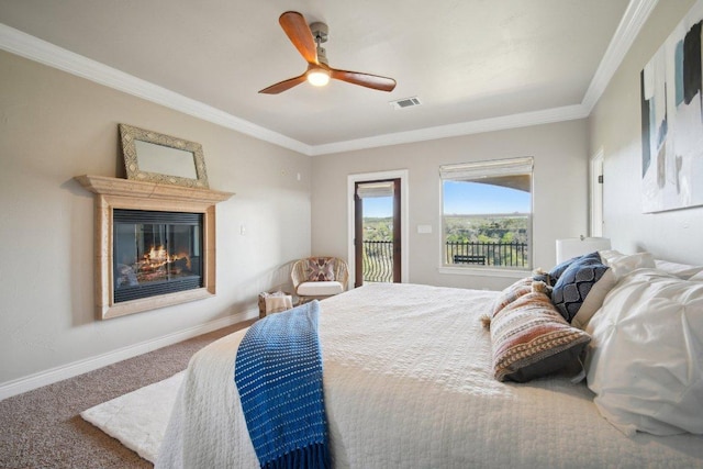 23617 Indian Divide Cv, Spicewood, TX 78669 - carpeted bedroom with access to exterior, a glass covered fireplace, ornamental molding, baseboards, and ceiling fan