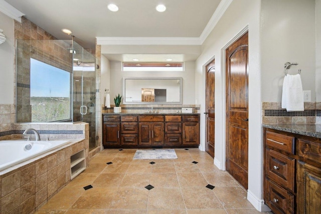 23617 Indian Divide Cv, Spicewood, TX 78669 - bathroom with ornamental molding, vanity, a stall shower, a garden tub, and recessed lighting