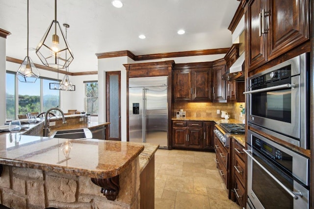 23617 Indian Divide Cv, Spicewood, TX 78669 - kitchen with stainless steel appliances, ornamental molding, a sink, decorative backsplash, and stone tile flooring