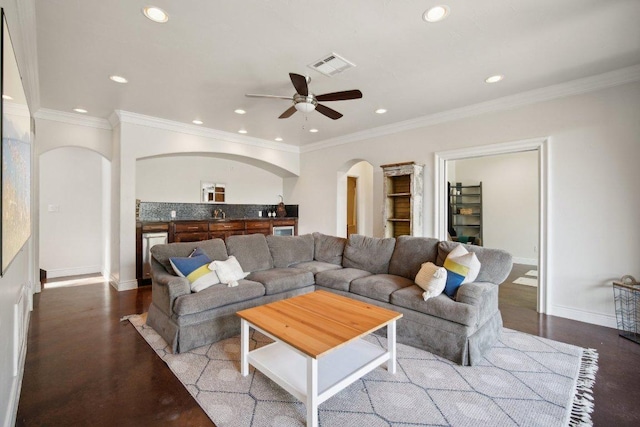 23617 Indian Divide Cv, Spicewood, TX 78669 - living room featuring arched walkways, ceiling fan, recessed lighting, baseboards, and ornamental molding