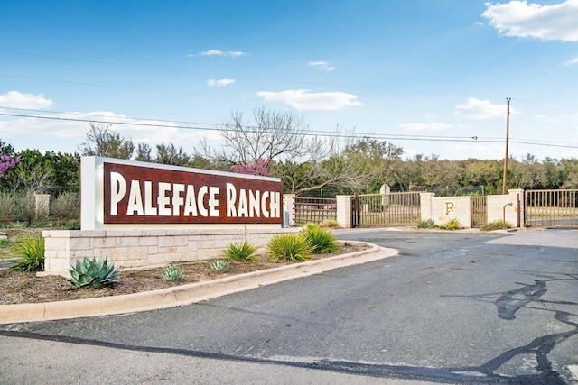 23617 Indian Divide Cv, Spicewood, TX 78669 - community sign with a gate