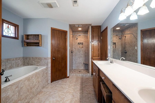 bathroom with a shower stall, visible vents, and a sink