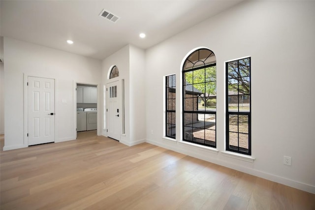 11107 Amblewood Way, Austin, TX 78753 - empty room with washer and clothes dryer, baseboards, light wood-style floors, and recessed lighting