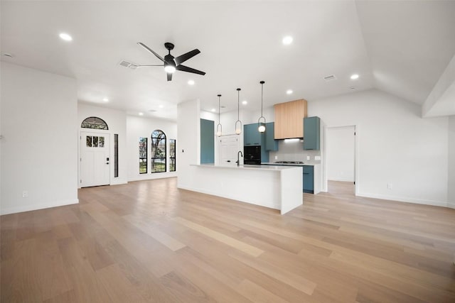 11107 Amblewood Way, Austin, TX 78753 - kitchen with open floor plan, recessed lighting, light countertops, a ceiling fan, and light wood-type flooring