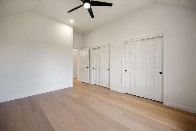 11107 Amblewood Way, Austin, TX 78753 - unfurnished bedroom with lofted ceiling, multiple closets, light wood-style flooring, baseboards, and recessed lighting
