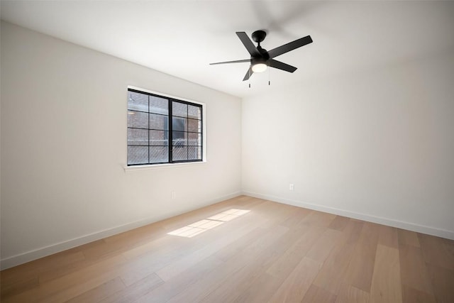 11107 Amblewood Way, Austin, TX 78753 - spare room featuring light wood finished floors, ceiling fan, and baseboards