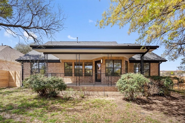 11107 Amblewood Way, Austin, TX 78753 - rear view of property featuring brick siding and a porch