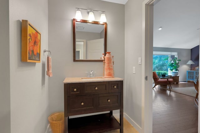 bathroom featuring baseboards and vanity