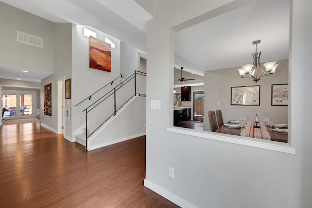 11214 Stormy Ridge Rd, Austin, TX 78739 - corridor featuring wood finished floors, a chandelier, and stairway