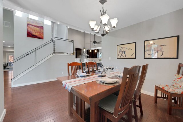 11214 Stormy Ridge Rd, Austin, TX 78739 - dining space featuring a ceiling fan, wood-type flooring, a high ceiling, a chandelier, and stairway