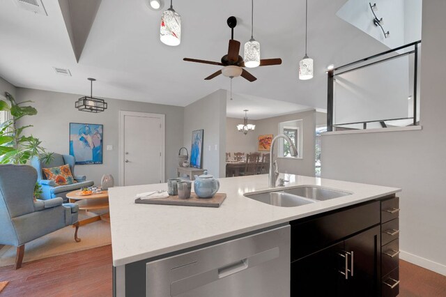 11214 Stormy Ridge Rd, Austin, TX 78739 - kitchen with dishwasher, light countertops, an island with sink, dark wood-style flooring, and open floor plan