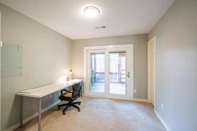 carpeted office space featuring baseboards