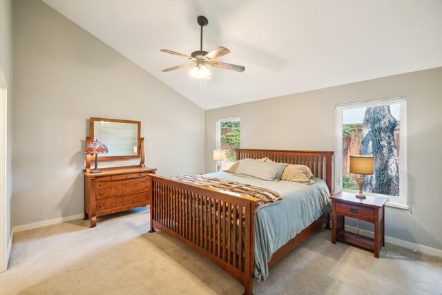 11214 Stormy Ridge Rd, Austin, TX 78739 - bedroom featuring light colored carpet, multiple windows, vaulted ceiling, and a ceiling fan