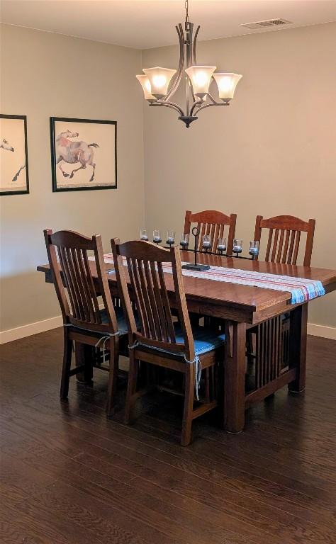 11214 Stormy Ridge Rd, Austin, TX 78739 - dining area featuring wood finished floors and a chandelier