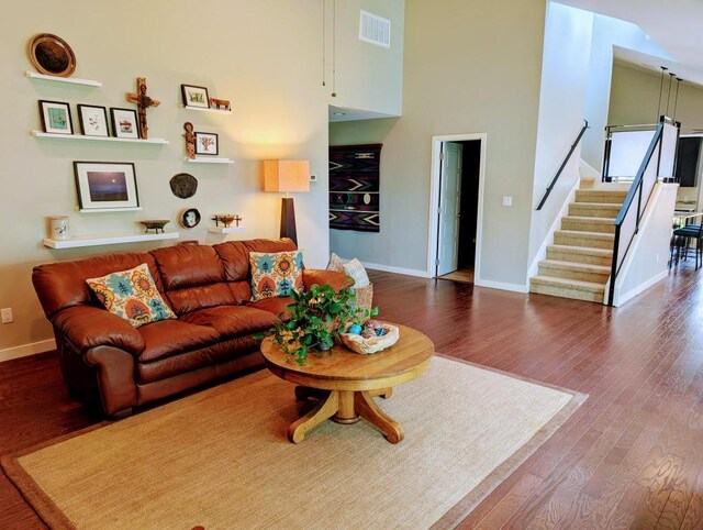 11214 Stormy Ridge Rd, Austin, TX 78739 - living room with wood finished floors, stairs, and a towering ceiling