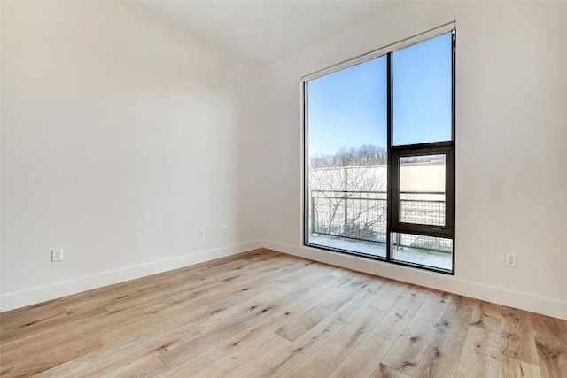 2525 S Lamar Blvd Unit 204, Austin, TX 78704 - unfurnished room with light wood-style floors and baseboards