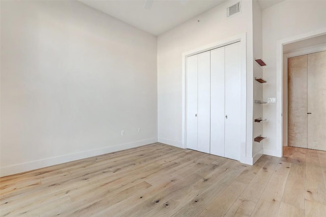 2525 S Lamar Blvd Unit 204, Austin, TX 78704 - unfurnished bedroom with wood-type flooring and a closet