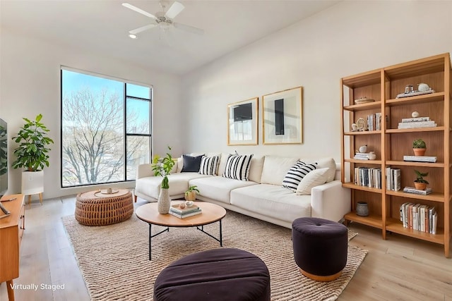 2525 S Lamar Blvd Unit 204, Austin, TX 78704 - living area featuring ceiling fan and light wood finished floors