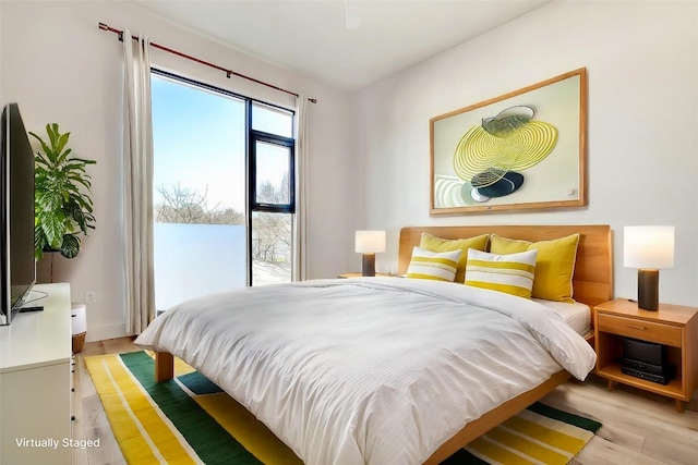 2525 S Lamar Blvd Unit 204, Austin, TX 78704 - bedroom featuring light wood-style flooring