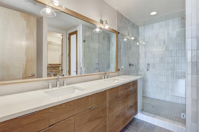 2525 S Lamar Blvd Unit 204, Austin, TX 78704 - full bath with double vanity, a stall shower, tile patterned floors, and recessed lighting