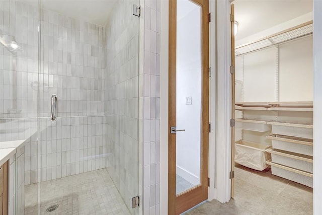 2525 S Lamar Blvd Unit 204, Austin, TX 78704 - bathroom featuring a shower stall and tile patterned flooring