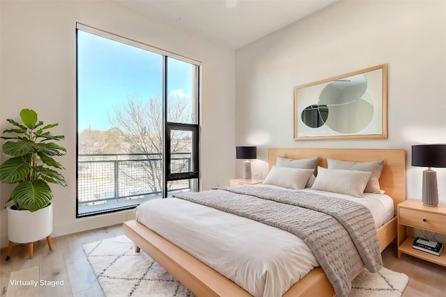 2525 S Lamar Blvd Unit 204, Austin, TX 78704 - bedroom with light wood finished floors