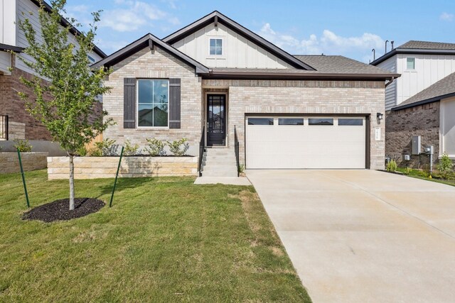 4329 Contrail Ln, Round Rock, TX 78665 - view of front of house featuring board and batten siding, brick siding, a front lawn, concrete driveway, and an attached garage