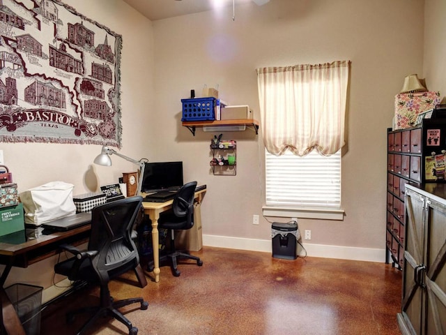 office with baseboards and a healthy amount of sunlight