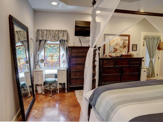 bedroom featuring concrete floors, baseboards, and recessed lighting