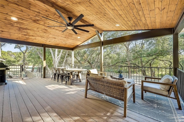 7601 Bar K Ranch Rd, Lago Vista, TX 78645 - wooden terrace with ceiling fan, outdoor lounge area, outdoor dining space, and view of wooded area