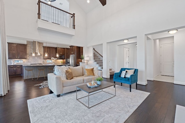 510 Doe Whisper Way, Austin, TX 78738 - living room with dark wood finished floors, stairway, and high vaulted ceiling