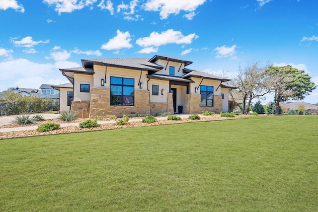 510 Doe Whisper Way, Austin, TX 78738 - prairie-style house featuring stone siding, a front lawn, and stucco siding