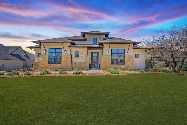 510 Doe Whisper Way, Austin, TX 78738 - prairie-style house featuring stone siding, a lawn, and stucco siding