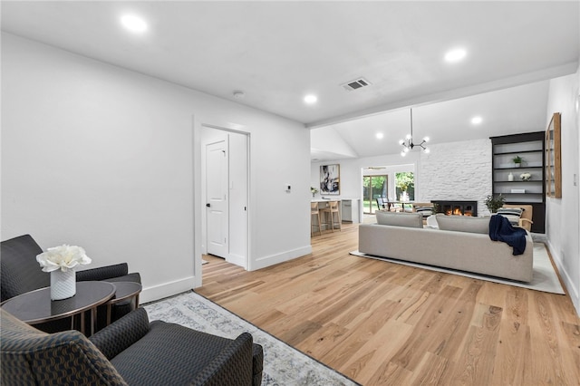 1004 Cripple Creek Dr, Austin, TX 78758 - living area with visible vents, baseboards, a fireplace, recessed lighting, and light wood-type flooring