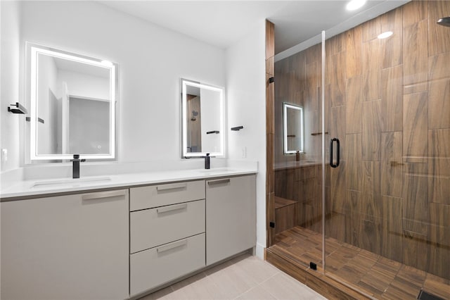 1004 Cripple Creek Dr, Austin, TX 78758 - bathroom featuring tile patterned floors, a sink, double vanity, and a shower stall