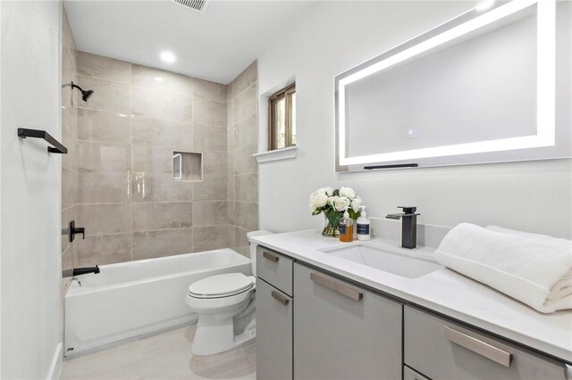 1004 Cripple Creek Dr, Austin, TX 78758 - bathroom featuring visible vents, toilet, tile patterned floors, vanity, and shower / bathing tub combination