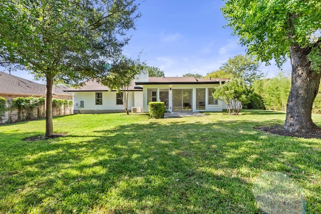1004 Cripple Creek Dr, Austin, TX 78758 - back of house with a lawn and fence