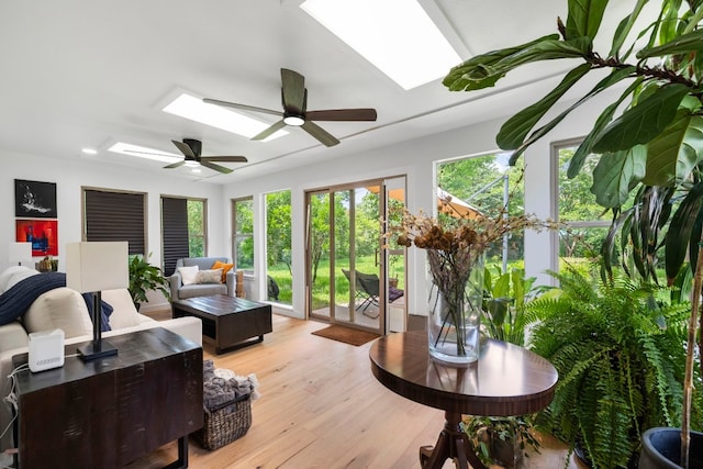 1004 Cripple Creek Dr, Austin, TX 78758 - sunroom / solarium with wood finished floors, a wooden deck, and a skylight