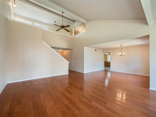 unfurnished living room with baseboards, beam ceiling, stairway, wood finished floors, and ceiling fan with notable chandelier