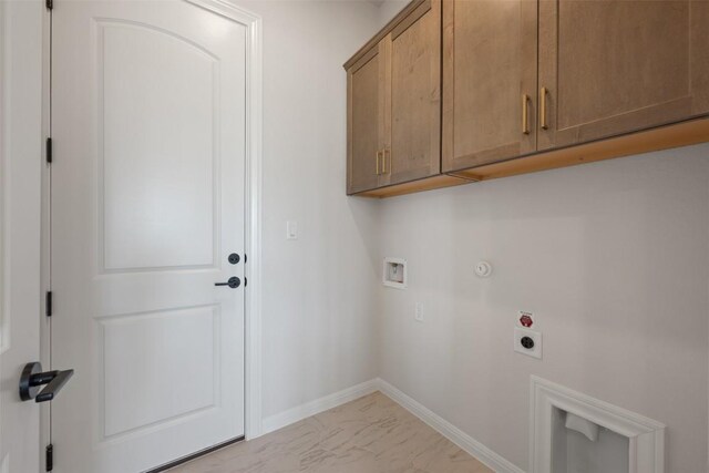 laundry room with baseboards, hookup for a washing machine, cabinet space, electric dryer hookup, and gas dryer hookup