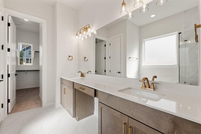 full bath featuring double vanity, a wealth of natural light, and a sink