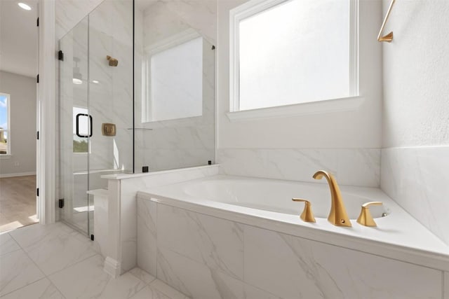 full bath with marble finish floor, a garden tub, and a marble finish shower