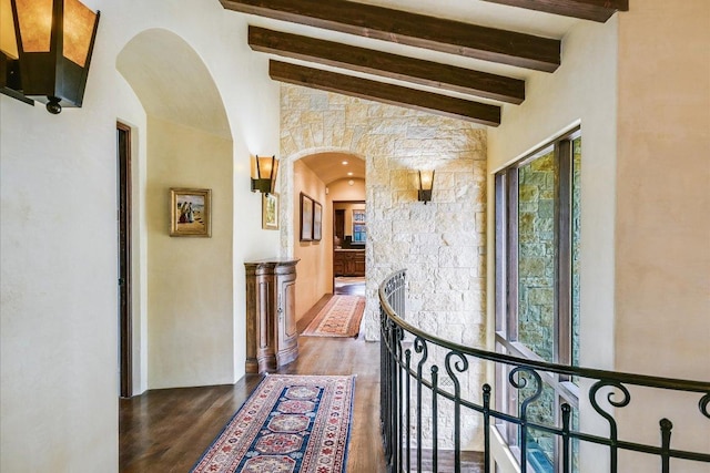 6704 Pixie Cv, Austin, TX 78746 - hall featuring arched walkways, beam ceiling, wood finished floors, and high vaulted ceiling