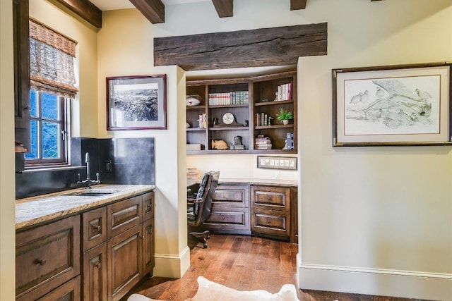 6704 Pixie Cv, Austin, TX 78746 - office featuring wood finished floors, built in desk, and beam ceiling