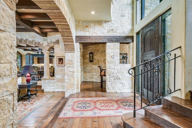 6704 Pixie Cv, Austin, TX 78746 - entryway with ornate columns, hardwood / wood-style floors, beamed ceiling, and stairway
