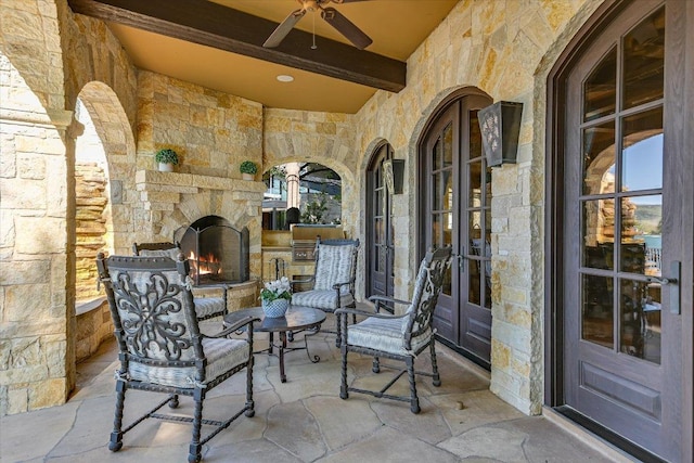 6704 Pixie Cv, Austin, TX 78746 - view of patio with an outdoor stone fireplace, french doors, and a ceiling fan