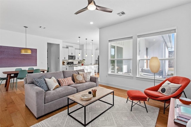 130 Volterra Ln, Dripping Springs, TX 78620 - living room with light wood-style floors, ceiling fan, and recessed lighting