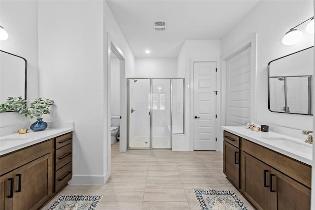 130 Volterra Ln, Dripping Springs, TX 78620 - full bath with a shower stall, two vanities, and recessed lighting