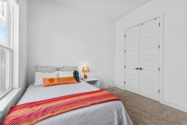 130 Volterra Ln, Dripping Springs, TX 78620 - carpeted bedroom featuring multiple windows and a closet