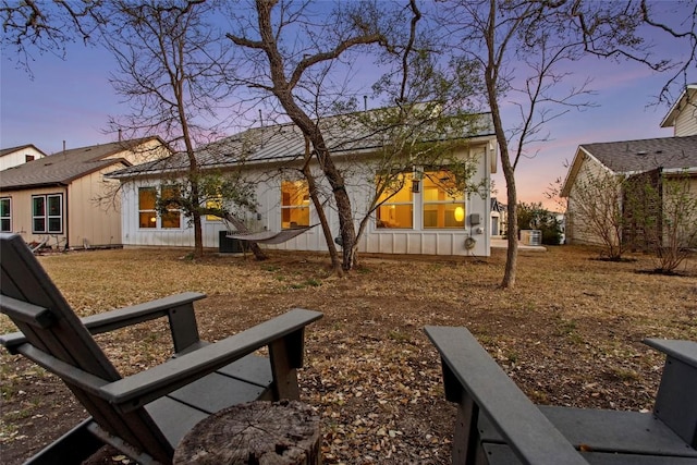 130 Volterra Ln, Dripping Springs, TX 78620 - rear view of property featuring board and batten siding